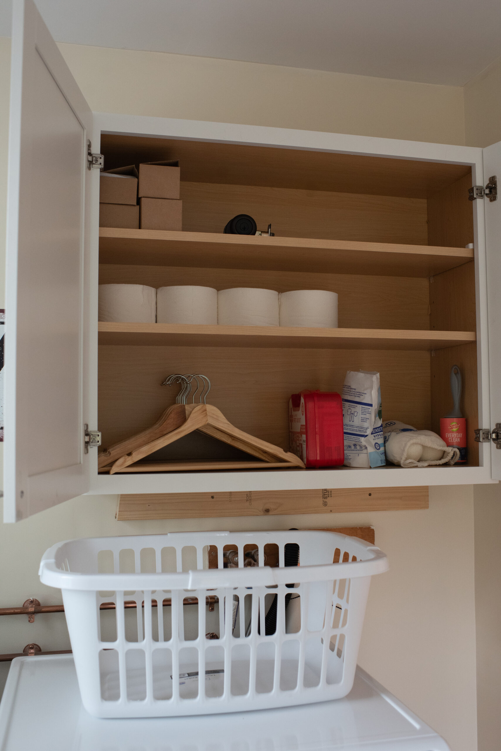 Laundry supply cabinet